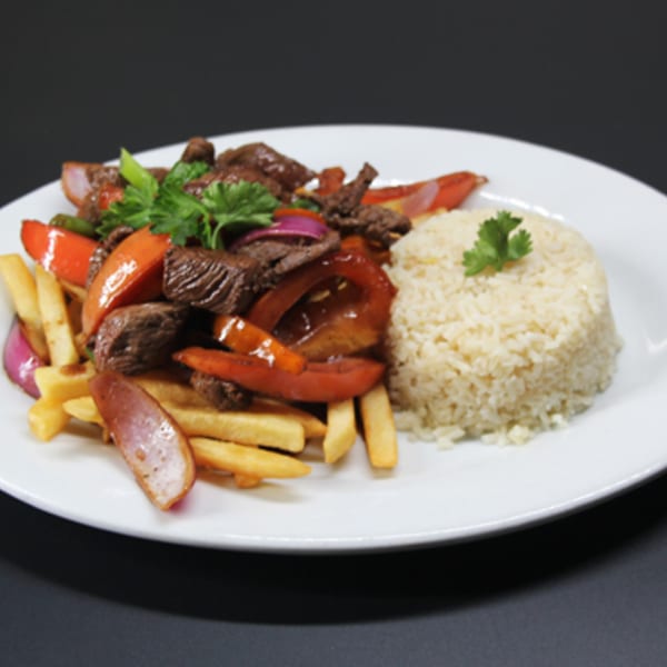 Speedy Tacos and Chicken's Lomo Saltado with beef, tomatoes, onions, fries, and rice.