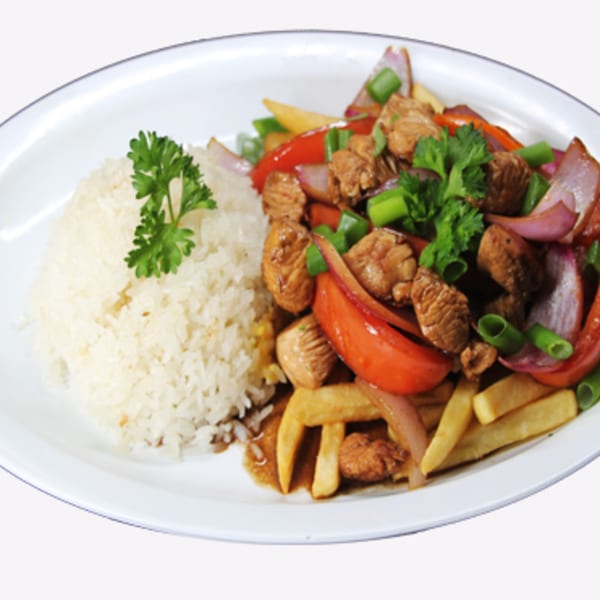 Speedy Tacos and Chicken's Lomo Saltado with rice, steak, fries, red onions, and tomatoes.