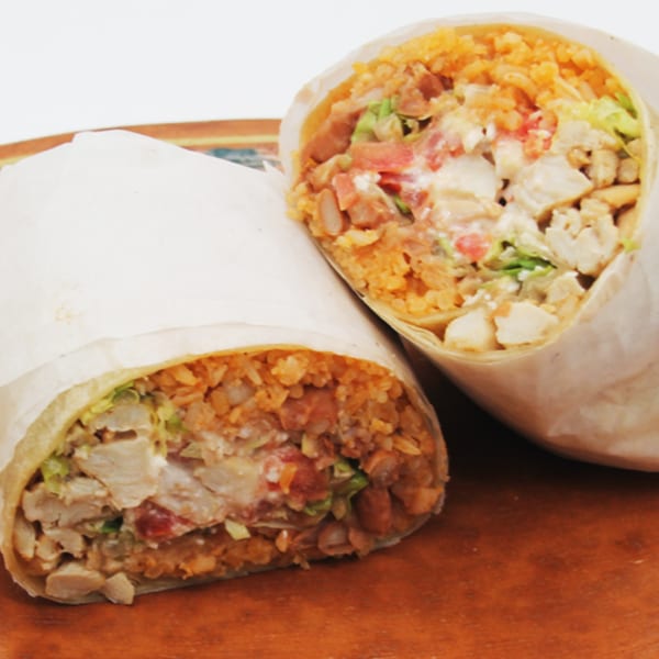Two Speedy Tacos and Chicken burritos, filled with chicken, rice, beans, and salsa.
